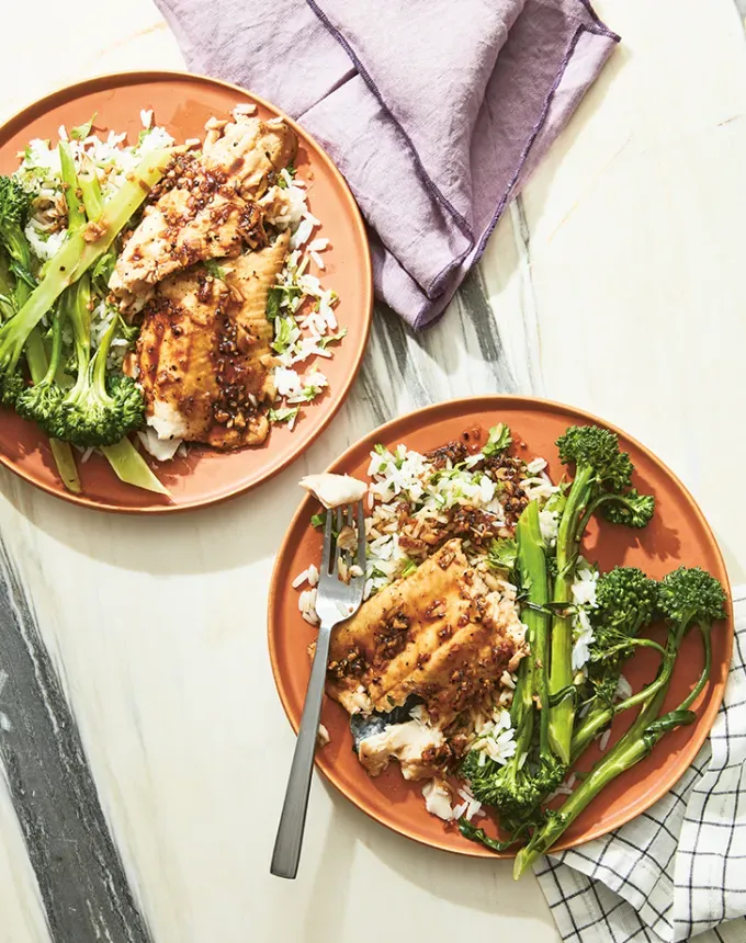 easy dinner recipes: two plates with rice veggies and caramelized black pepper trout' title='65 Easy Dinner Recipes for Beginners (That Even the Most Culinarily Challenged Can Manage)