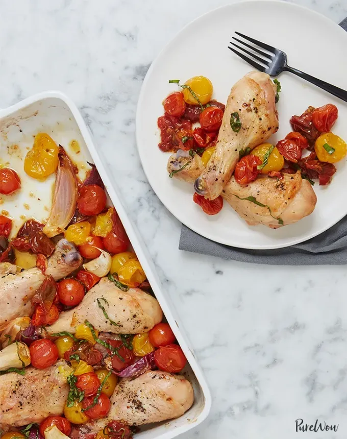 chicken holiday recipes: roasted drumsticks with tomatoes' title='50 Easy Christmas Chicken Recipes That Are Perfect for the Holidays