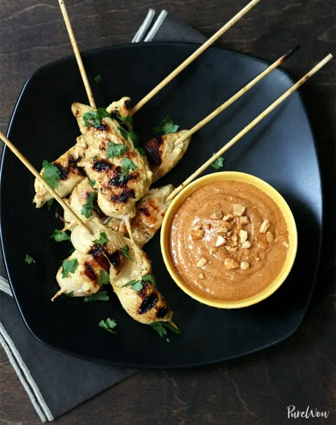 chicken holiday recipes: chicken satay with coconut peanut sauce' title='50 Easy Christmas Chicken Recipes That Are Perfect for the Holidays