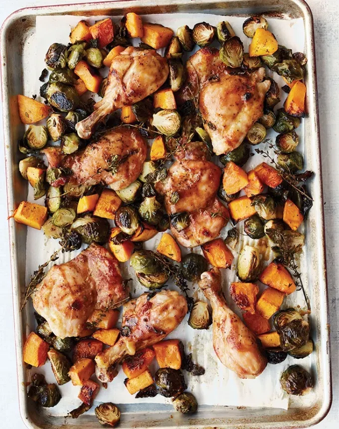 chicken holiday recipes: dijon maple chicken with brussels sprouts and butternut squash' title='50 Easy Christmas Chicken Recipes That Are Perfect for the Holidays