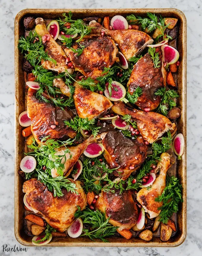 chicken holiday recipes: pomegranate sumac chicken with roasted carrots' title='50 Easy Christmas Chicken Recipes That Are Perfect for the Holidays