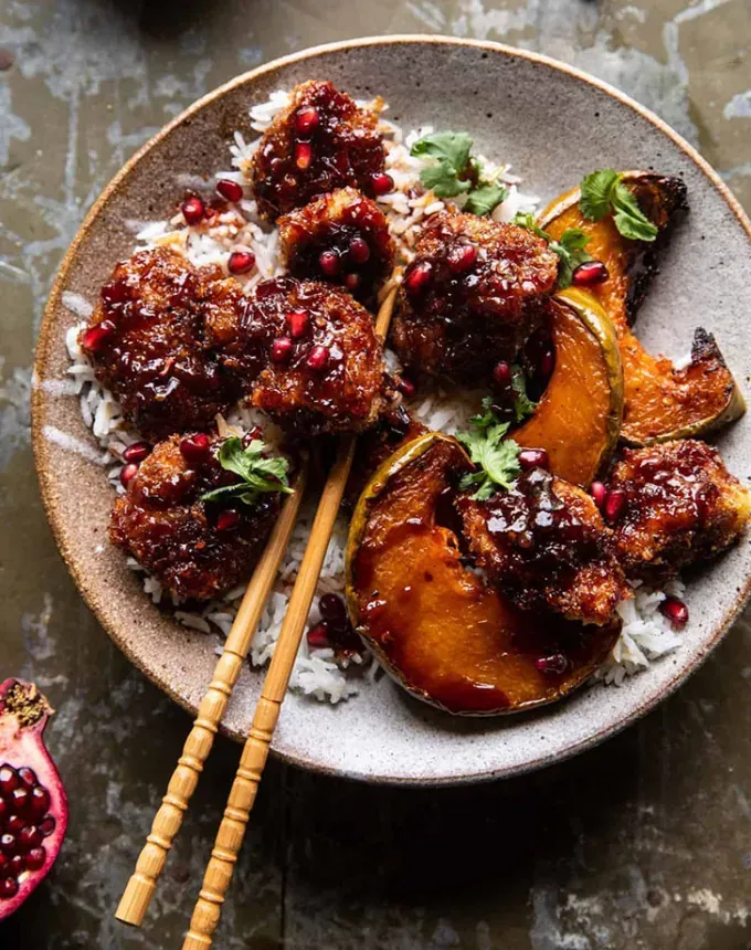 chicken holiday recipes: sheet pan sticky pomegranate chicken' title='50 Easy Christmas Chicken Recipes That Are Perfect for the Holidays