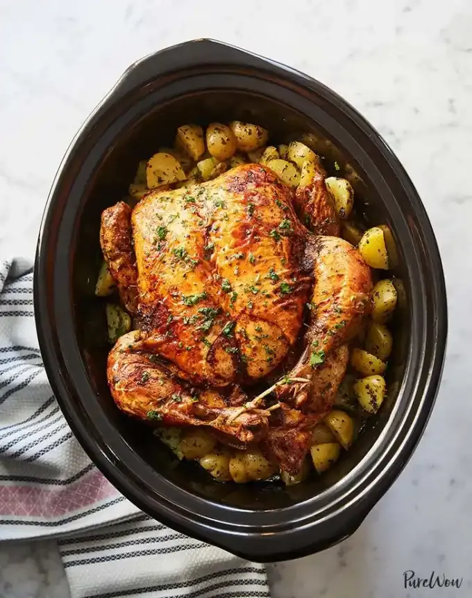 easy christmas dinner recipes: slow cooker whole chicken with potatoes' title='75 Easy Christmas Dinner Ideas That Anyone Can Cook (and Everyone Will Love)