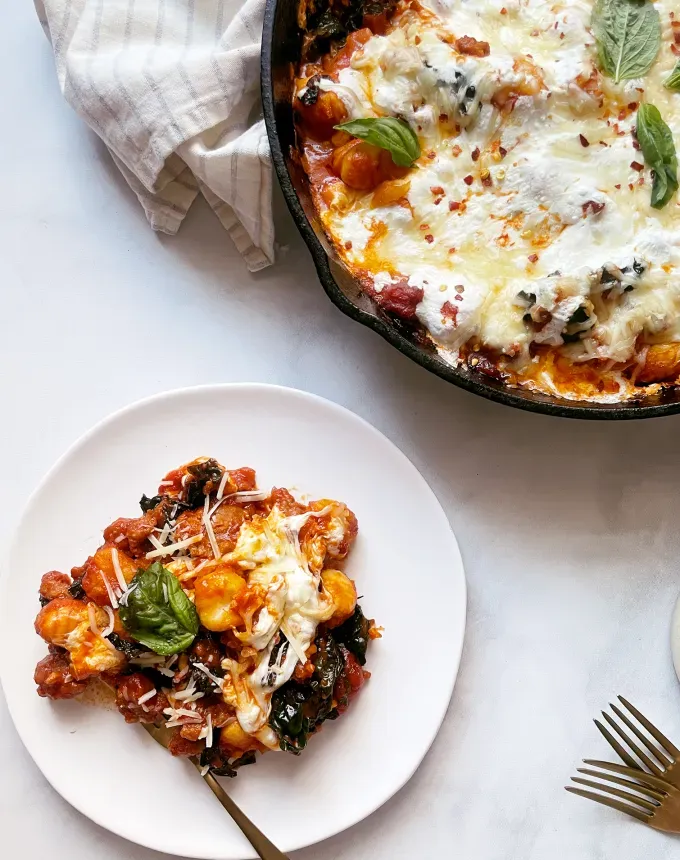 easy christmas dinner idea: skillet gnocchi bake with sausage and kale' title='75 Easy Christmas Dinner Ideas That Anyone Can Cook (and Everyone Will Love)