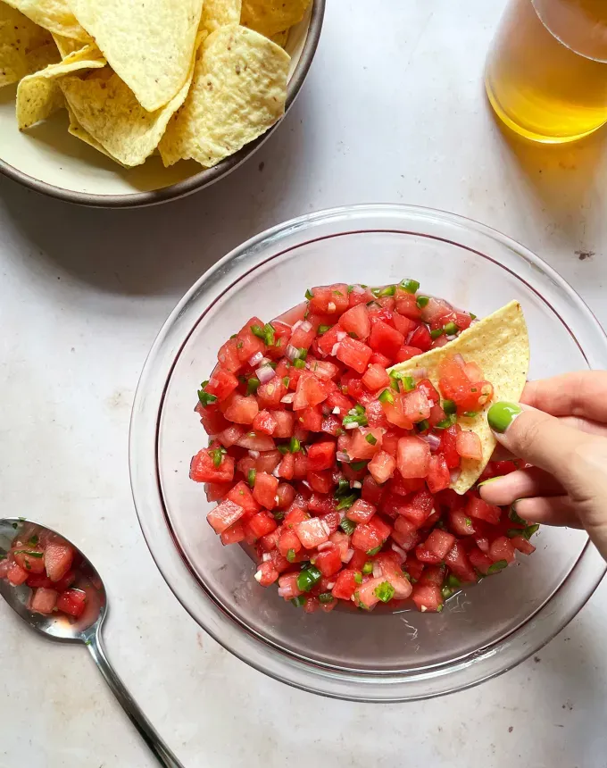 easy snacks to make at home: watermelon salsa' title='51 Easy Snacks to Make at Home (That Aren’t Cheese and Crackers for the Millionth Time)