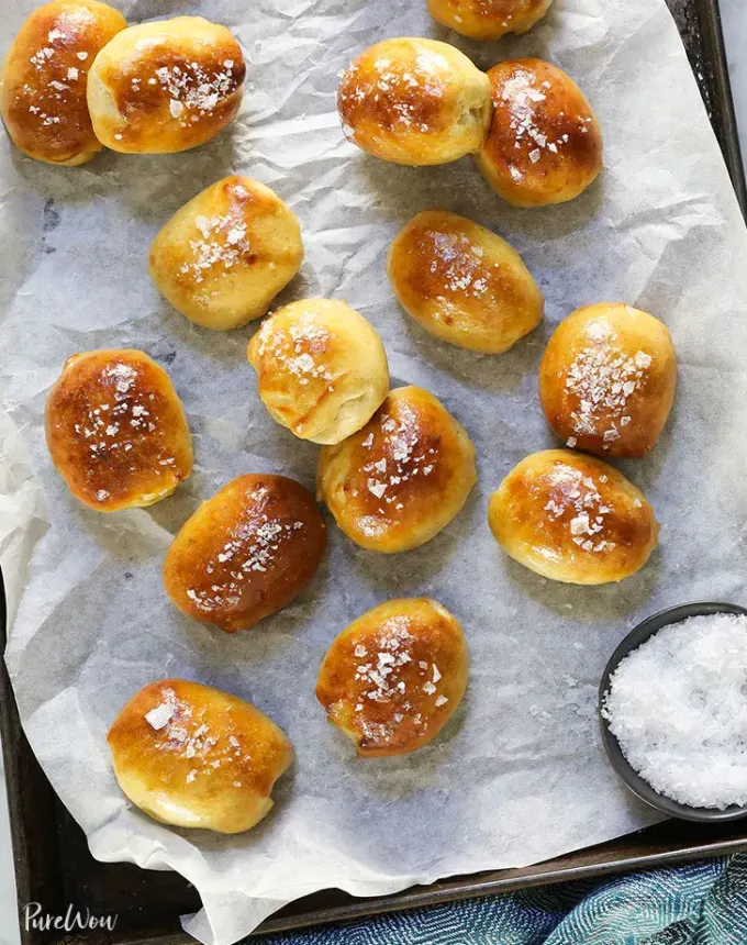 easy snacks to make at home: brie stuffed pretzel bites' title='51 Easy Snacks to Make at Home (That Aren’t Cheese and Crackers for the Millionth Time)