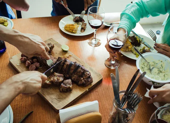 how to cook steak in the oven only: family having steak dinner' fetchpriority='auto' title='How to Cook Steak in the Oven Only