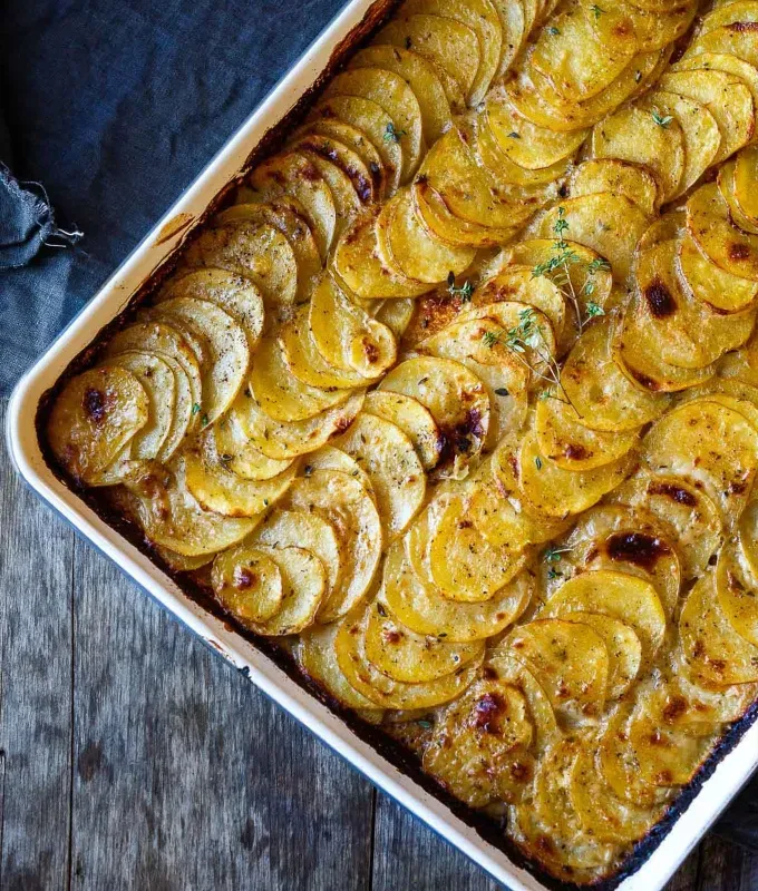 Scalloped Potatoes Nontraditional Christmas Dinner' title='53 Nontraditional Christmas Dinner Ideas to Shake Up the 2024 Holiday Season