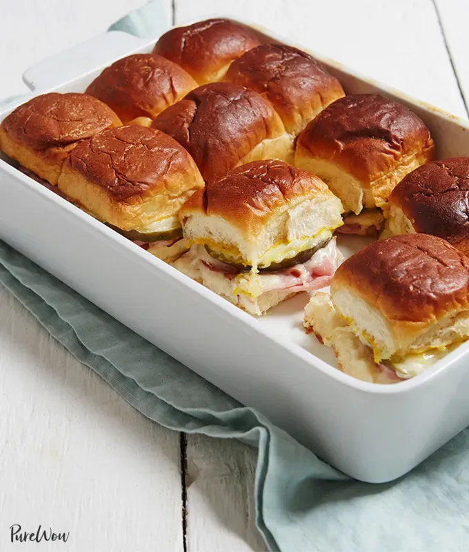 best big-batch recipes: casserole dish of cuban sliders with one spot empty' title='76 Big-Batch Dishes & Recipes to Feed a Crowd