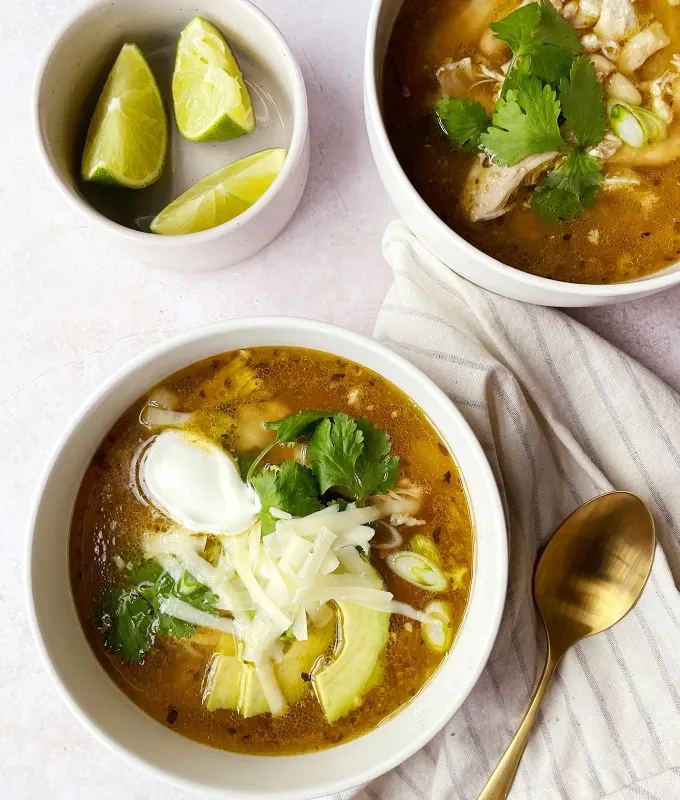 best big-batch recipes: two bowls of spicy green chicken chili made in the slow cooker' title='76 Big-Batch Dishes & Recipes to Feed a Crowd