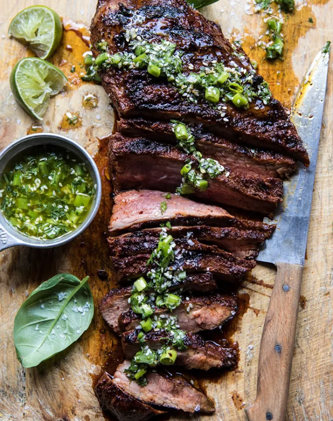 best big-batch recipes: korean grilled steak with toasted sesame chimichurri on a cutting board' title='76 Big-Batch Dishes & Recipes to Feed a Crowd