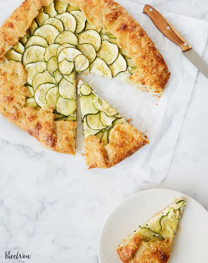 best big-batch recipes: zucchini ricotta galette with a slice missing on a plate' title='76 Big-Batch Dishes & Recipes to Feed a Crowd