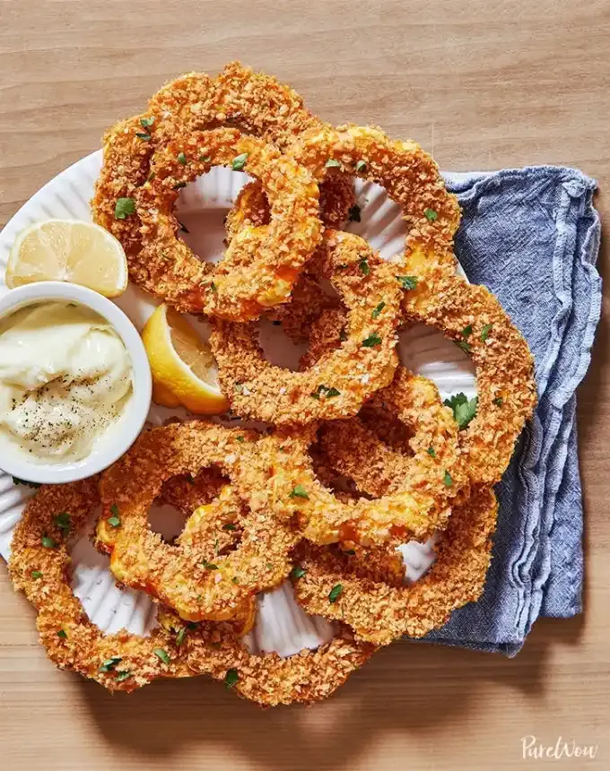 best big-batch recipes: crispy breaded delicata squash rings on a plate with aioli for dipping' title='76 Big-Batch Dishes & Recipes to Feed a Crowd