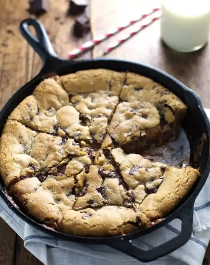 best big-batch recipes: deep-dish skillet chocolate chip cookie with a slice missing' title='76 Big-Batch Dishes & Recipes to Feed a Crowd