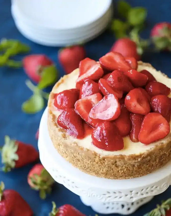 best big-batch recipes: aerial view of a cheesecake topped with strawberries' title='76 Big-Batch Dishes & Recipes to Feed a Crowd