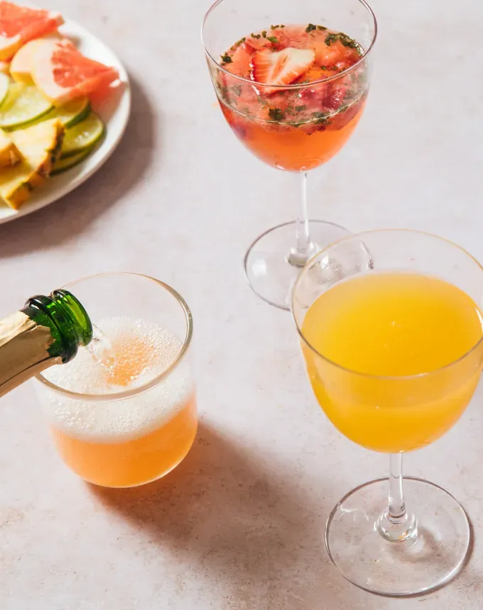 mimosa bar with paloma tropical and strawberry-basil mimosas' title='76 Big-Batch Dishes & Recipes to Feed a Crowd