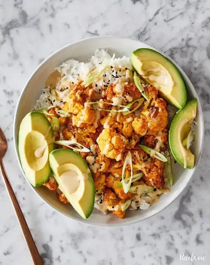 october dinner recipes: tandoori inspired roast cauliflower bowls with tahini drizzle' title='31 October Dinner Ideas That Are Just Right for Sweater Weather