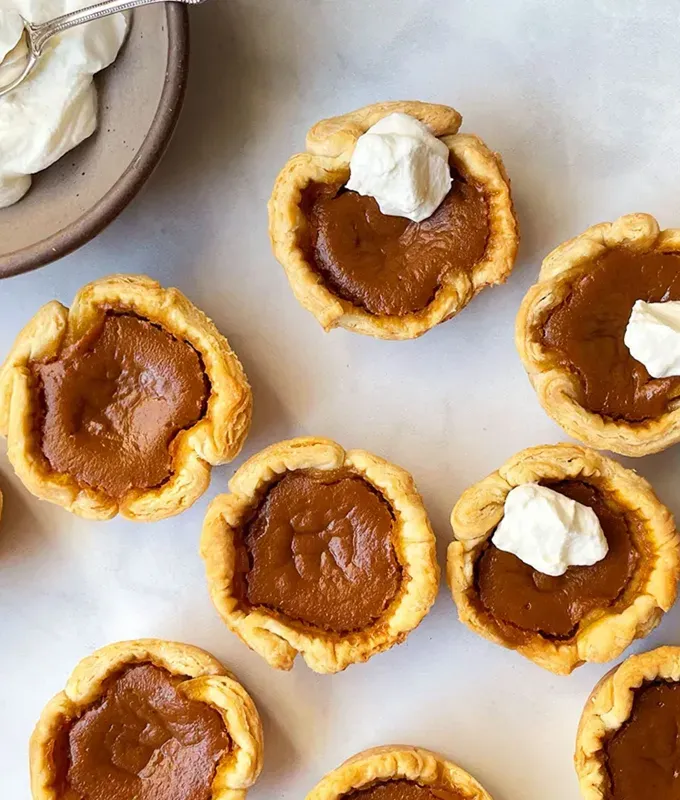 mini thanksgiving dessert recipes: mini pumpkin pies' title='54 Mini Thanksgiving Desserts That Are (Almost) Too Cute to Eat