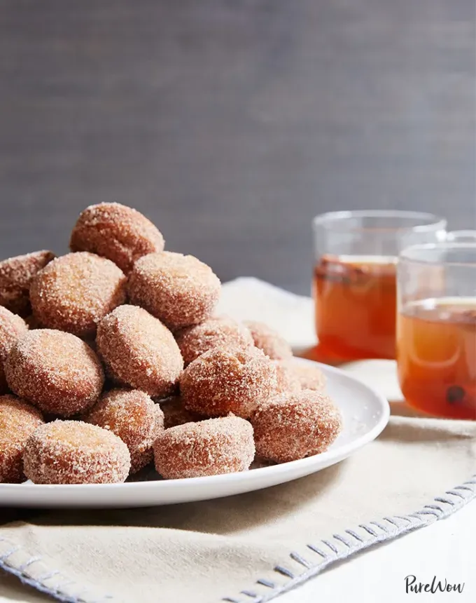 mini thanksgiving dessert recipes: apple cider doughnut holes' title='54 Mini Thanksgiving Desserts That Are (Almost) Too Cute to Eat