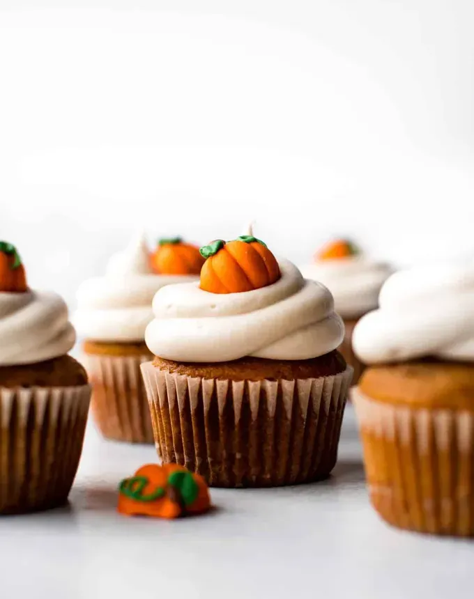 mini thanksgiving dessert recipes: pumpkin cupcakes cream cheese frosting' title='54 Mini Thanksgiving Desserts That Are (Almost) Too Cute to Eat