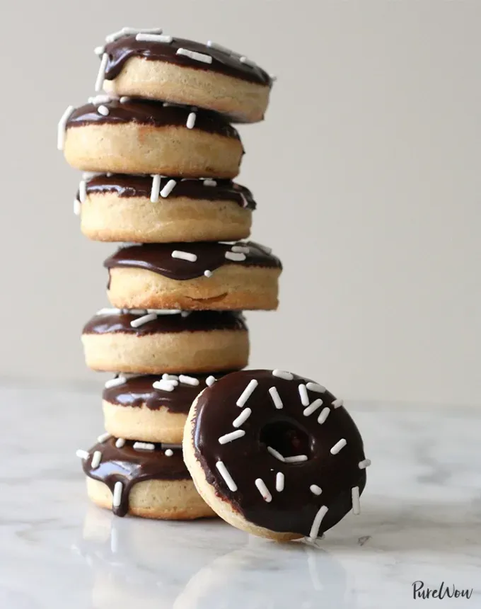 mini thanksgiving dessert recipes: mini baked doughnuts with chocolate glaze' title='54 Mini Thanksgiving Desserts That Are (Almost) Too Cute to Eat