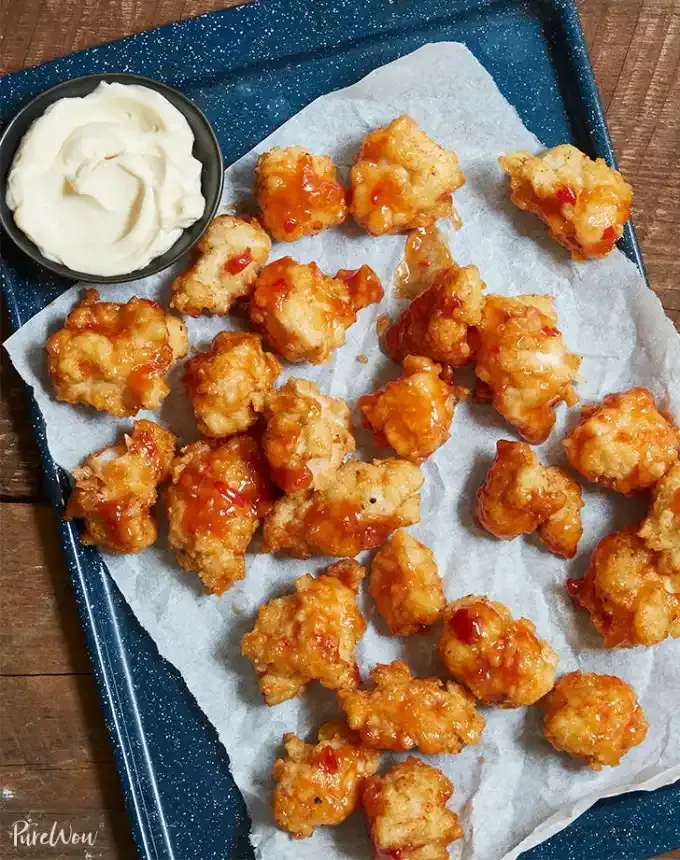 finger food recipes for a crowd: spicy glazed popcorn chicken' title='68 Easy Finger Food Appetizers Everyone Will Love