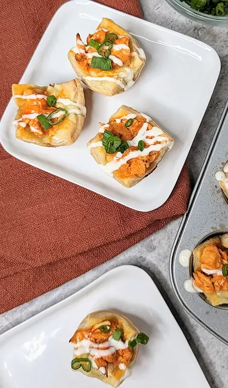 buffalo chicken brie bites on a plate' title='68 Easy Finger Food Appetizers Everyone Will Love