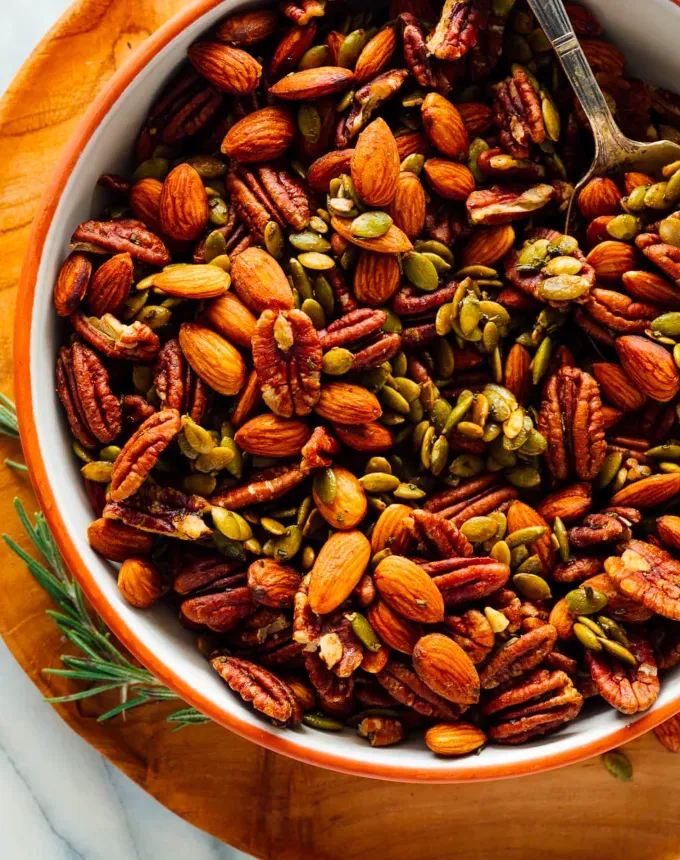 snack mix recipes: sweet and spicy roasted party nuts' title='23 Snack Mix Recipes You Won’t Be Able to Put Down