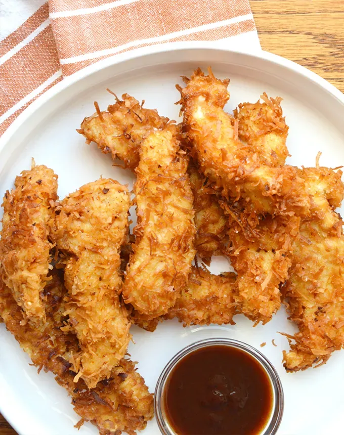 toddler meals: crispy coconut chicken tenders' title='25 Toddler Meals That Are Easy and Lazy Parent–Friendly (and Mostly 30 Minutes or Less)