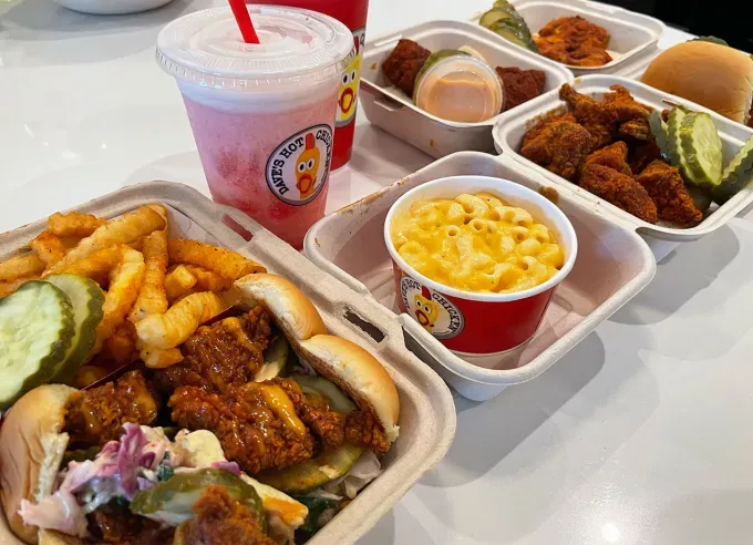 dave’s hot chicken mini sliders review: array of dave’s hot chicken food and drink' fetchpriority='auto' title='Dave’s Hot Chicken Just Launched a *Micro* Version of Its Cult-Favorite Chicken Sliders—Here’s My Review