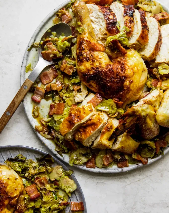 alternate thanksgiving dinner recipes: spatchcocked roast chicken with shredded brussels sprouts and bacon' title='29 Alternative Thanksgiving Meals (That Just Might Be Better Than Turkey)