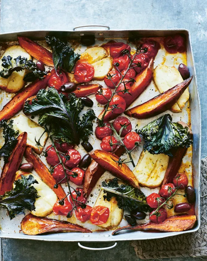 fall vegetarian recipes: sweet potato tomato kale and halloumi sheet tray' title='30 Fall Vegetarian Recipes That Are Cozy Hearty and Packed with Seasonal Produce
