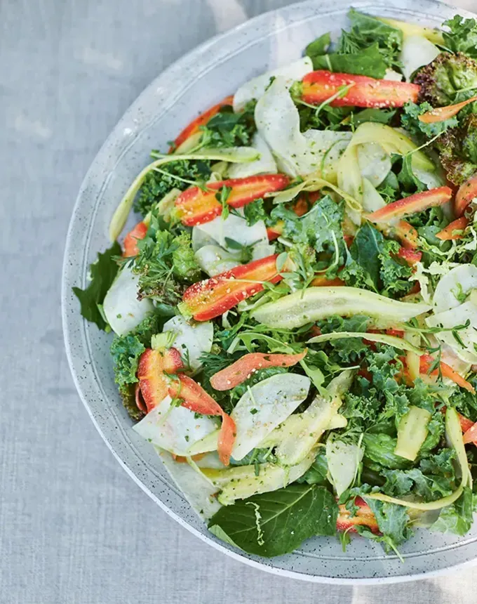 fall vegetarian recipes: crisp fall green salad with benne seed ginger dressing' title='30 Fall Vegetarian Recipes That Are Cozy Hearty and Packed with Seasonal Produce