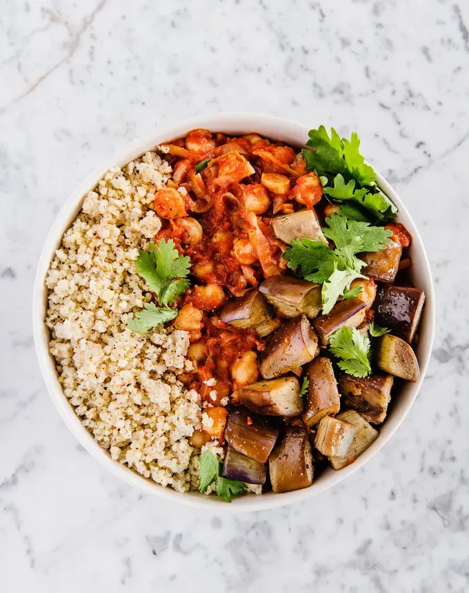 fall vegetarian recipes: harissa chickpea stew with eggplant and millet' title='30 Fall Vegetarian Recipes That Are Cozy Hearty and Packed with Seasonal Produce