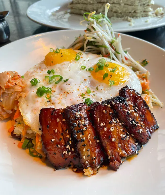 cheesecake factory brunch menu review: kimchi pork belly fried rice bowl' title='FYI The Cheesecake Factory Does Brunch—and I Tasted & Ranked the Entire Menu