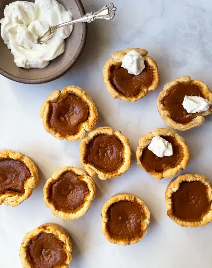 mini christmas desserts: mini pumpkin pies' title='31 Mini Christmas Desserts That Are Equal Parts Delightful and Delicious