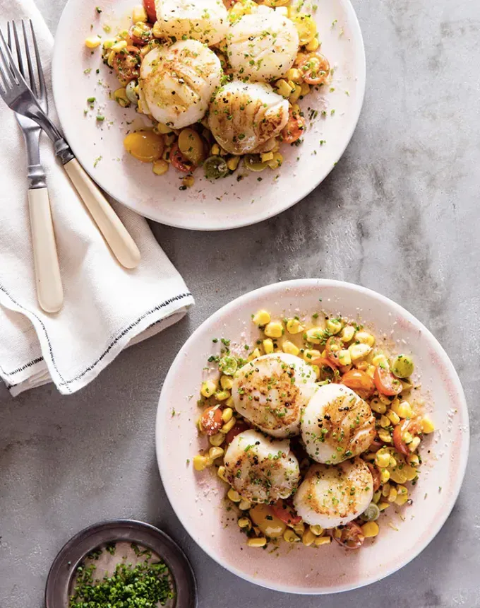 clean eating dinner recipes: pan-seared scallops with citrusy corn succotash' title='65 Clean-Eating Dinner Recipes for the New Year and Beyond