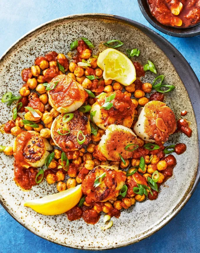 clean eating dinner recipes: crispy chickpeas and scallops with garlic harissa oil' title='65 Clean-Eating Dinner Recipes for the New Year and Beyond