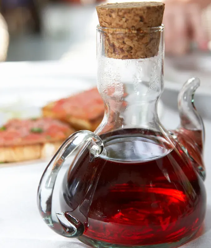 substitute for balsamic vinegar: decanter filled with red wine vinegar and topped with a cork' fetchpriority='auto' title='Need a Substitute for Balsamic Vinegar? Here Are 4 Clever Swaps