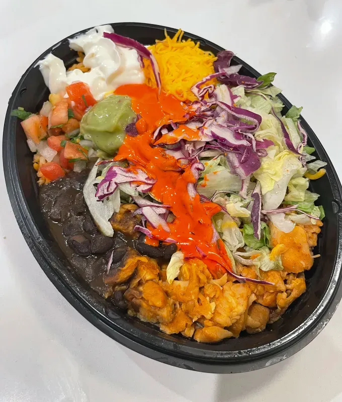 new taco bell menu items review: caliente cantina chicken bowl' title='A Food Editor’s Ranking (and Photos) of Taco Bell’s 10 Newest Menu Items Including Toasted Cheddar Street Chalupas