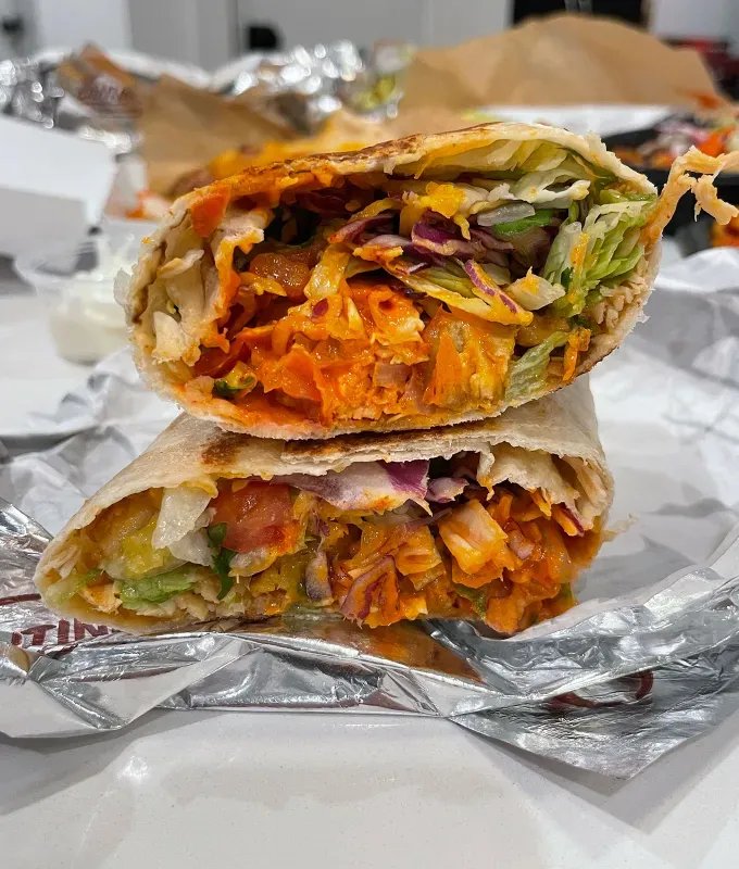 new taco bell menu items review: caliente cantina chicken burritos' title='A Food Editor’s Ranking (and Photos) of Taco Bell’s 10 Newest Menu Items Including Toasted Cheddar Street Chalupas