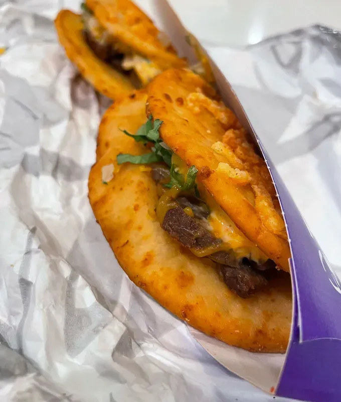 new taco bell menu items review: steak toasted cheddar chalupas' title='A Food Editor’s Ranking (and Photos) of Taco Bell’s 10 Newest Menu Items Including Toasted Cheddar Street Chalupas