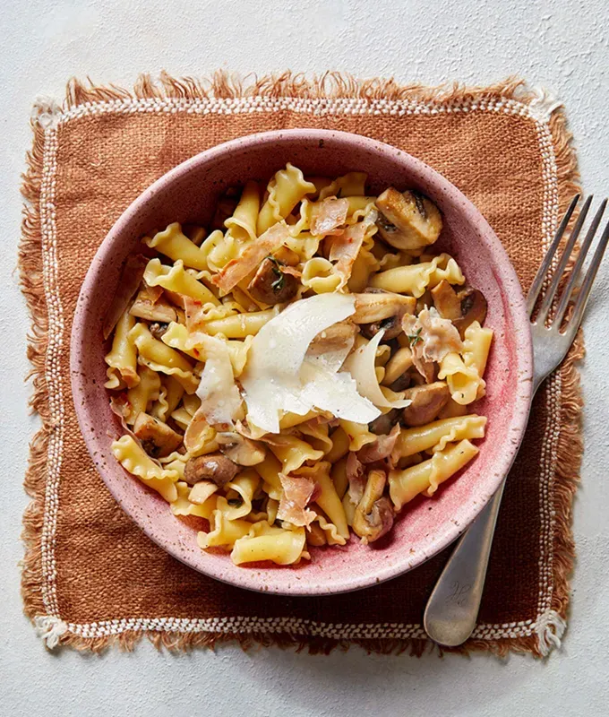 fall pasta recipes: caramelized mushroom pasta with crispy prosciutto' title='25 Fall Pasta Recipes to Serve This Season That Taste Like Pure Comfort Food