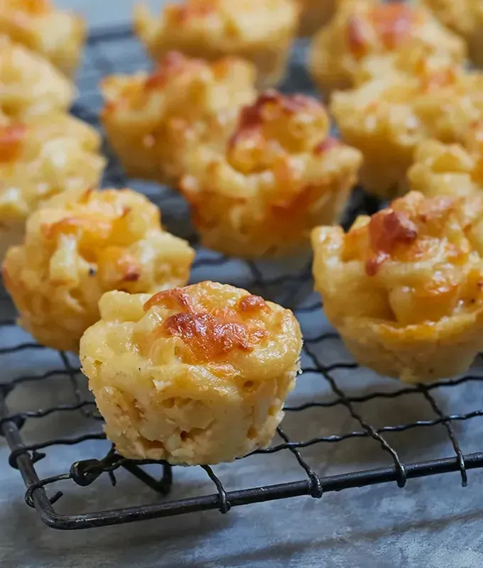 bite-sized-appetizers: Baked Mac and Cheese Bites.' title='45 Bite-Sized Appetizers That Are as Cute as They Are Delicious
