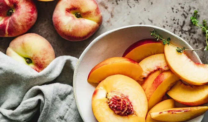 high protein fruits: peaches' fetchpriority='auto' title='12 High-Protein Fruits to Add to Your Diet According to a Nutritionist