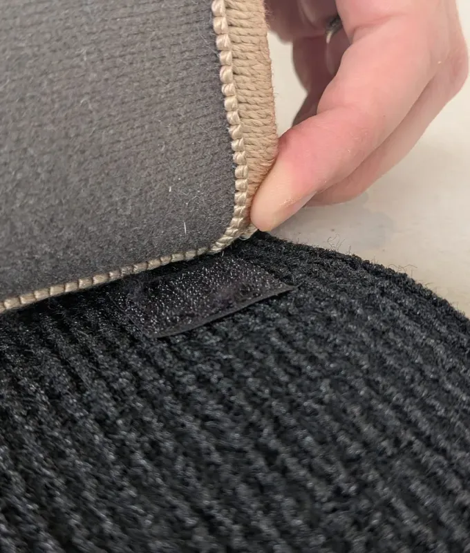 how the ruggable rug cover attaches to the pad' title='The Only 4 Washable Rugs Worth Buying Based on Serious Stress-Testing