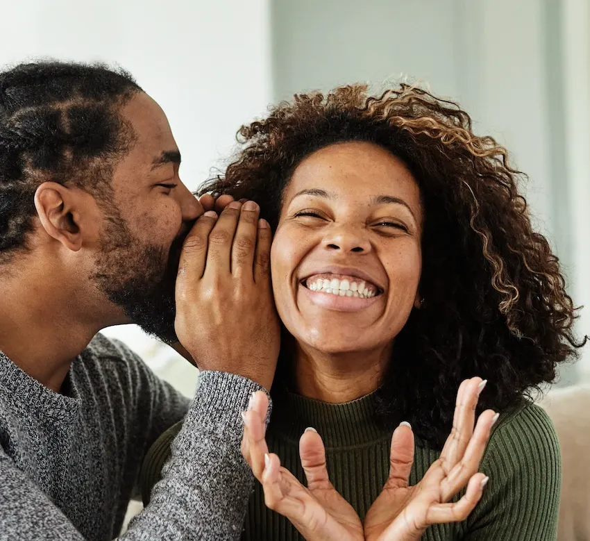 Man whispers in excited woman’s ear' title='Differences Between How Men & Women Fall In Love That Honestly Explain Everything' typeof='foaf:Image' decoding='async