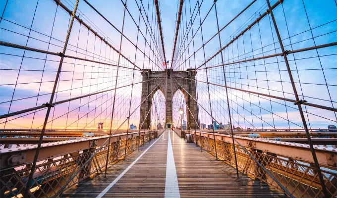 things-to-do-on-a-sunday-in-nyc: A photo of the Brooklyn Bridge taken from on the bridge at dusk.' fetchpriority='auto' title='18 Things to Do on a Sunday in NYC That Are Anything But Boring