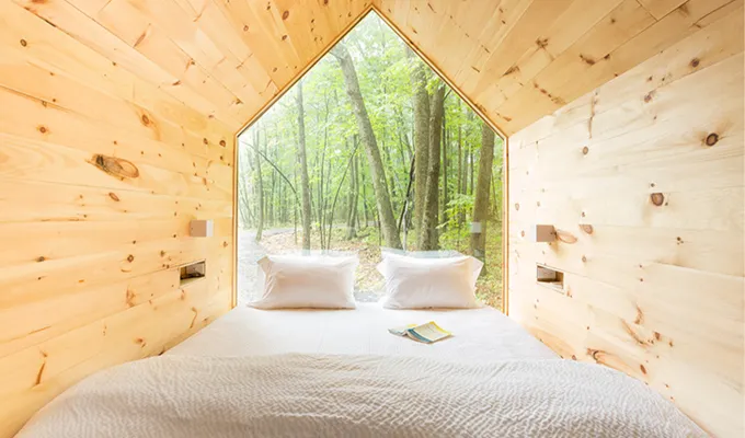 Inside of a tent with bed.' title='22 Awesome Places to Go Glamping Near New York City