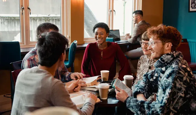 how to make friends in nyc a group of people reading books and drinking coffee' fetchpriority='auto' title='How to Make Friends in NYC According to New Yorkers
